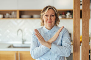 A caregiver practices self-care by setting boundaries in caregiving.