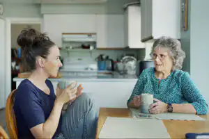 A woman who understands the importance of connecting with loved ones with dementia shares a chat with her aging relative.